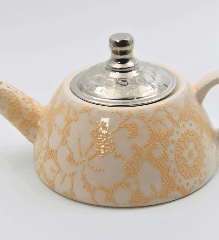 Ceramic teapot with lace pattern