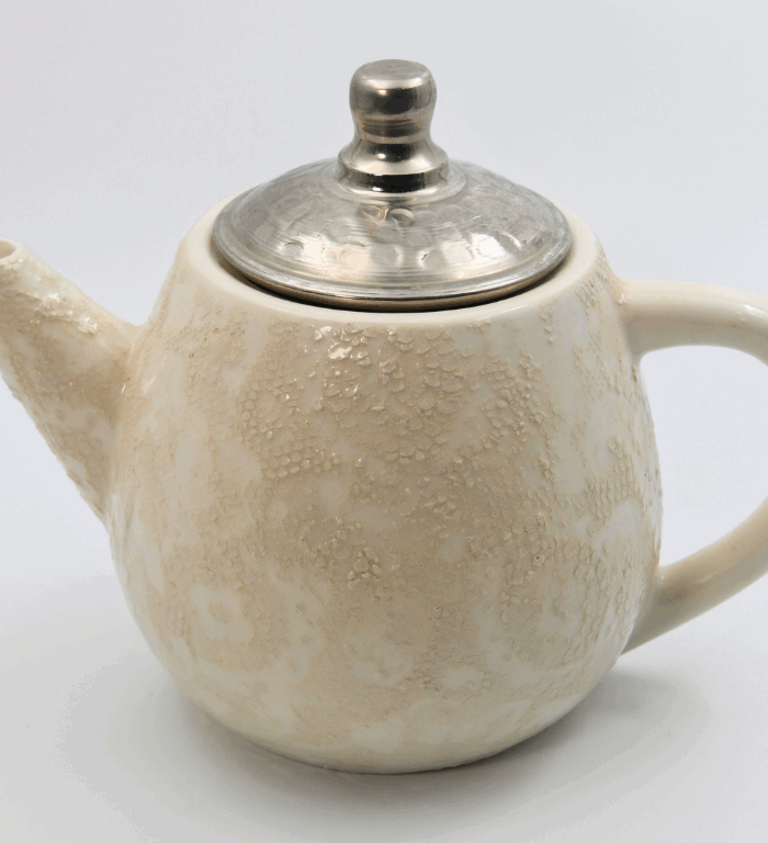 Ceramic teapot with lace pattern