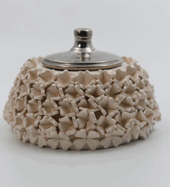 Ceramic sugar bowl decorated with raised flowers